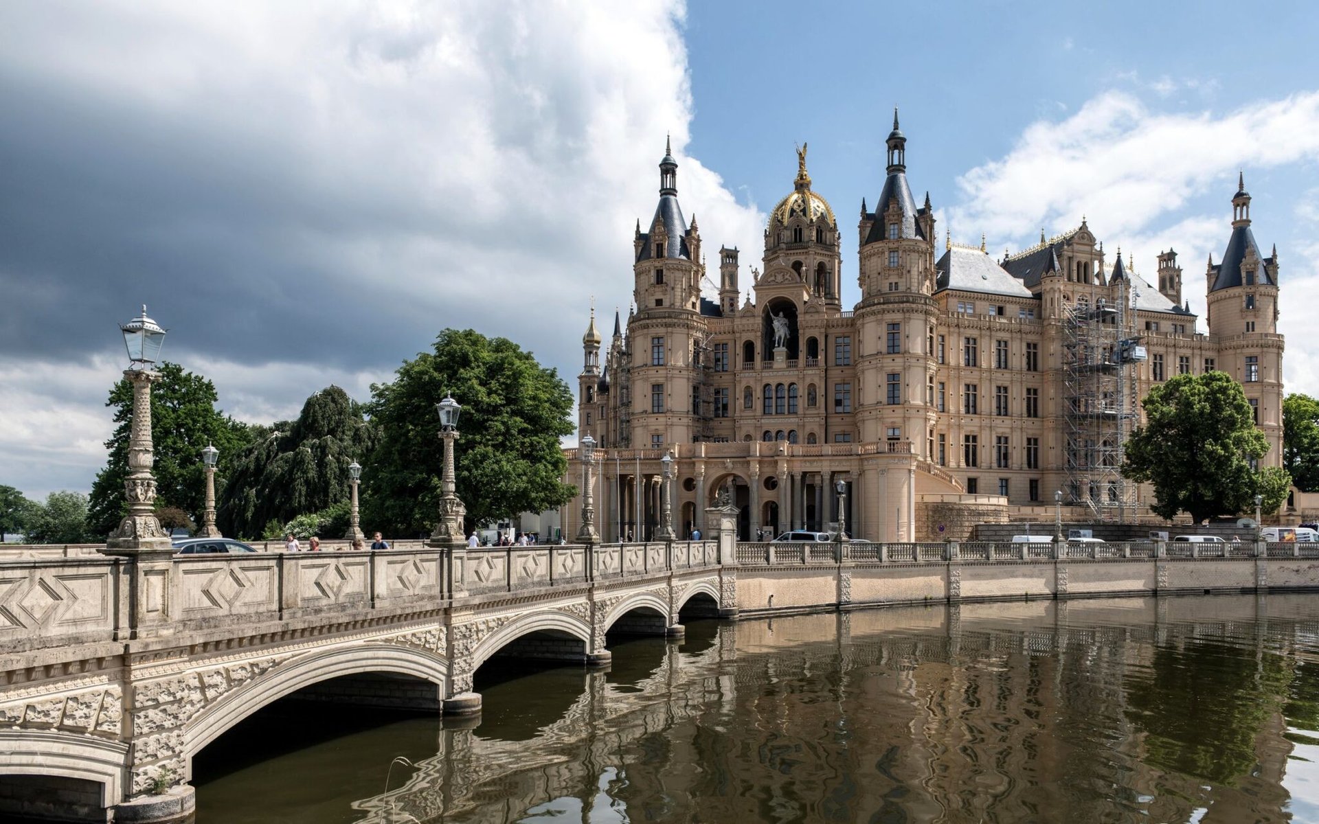 Stunning view of Schwerin Castle with its historic bridge and scenic surroundings in Germany.