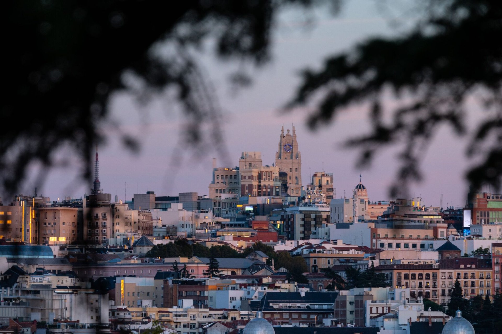 Beautiful cityscape of Madrid, Spain, captured during twilight with iconic landmarks visible.