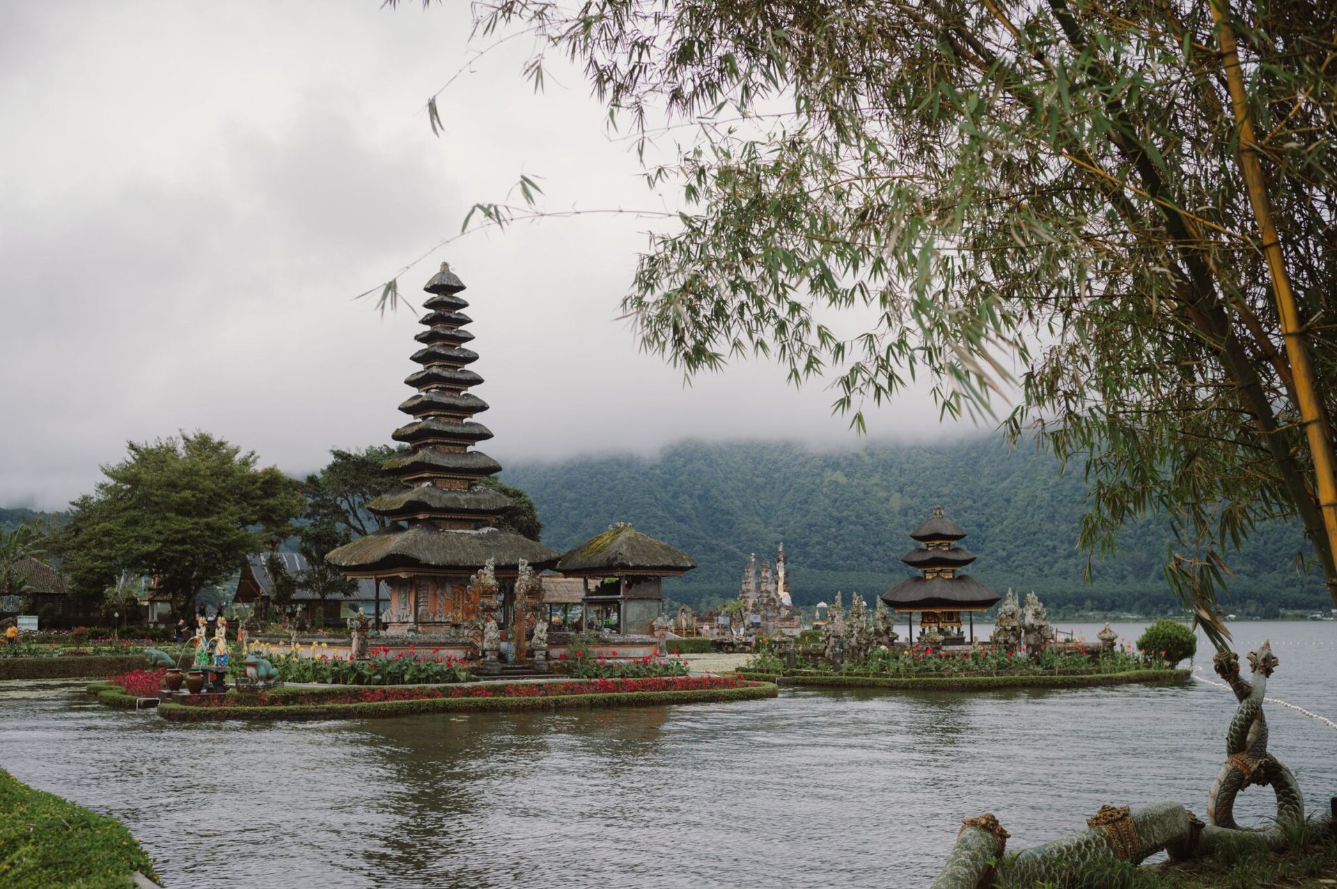 Beautiful view of Ulun Danu Beratan Temple on the lake with lush surroundings in Bali, Indonesia.