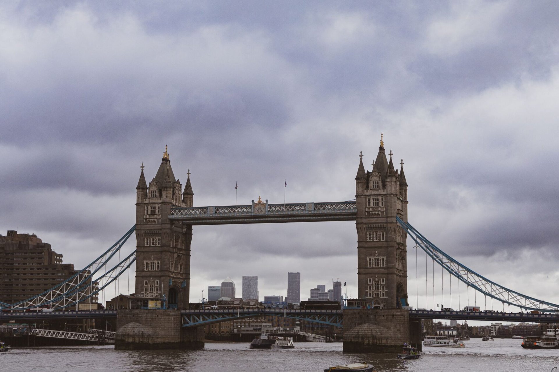 Scenic view of Tower Bridge over the River Thames in London with cloudy skies.