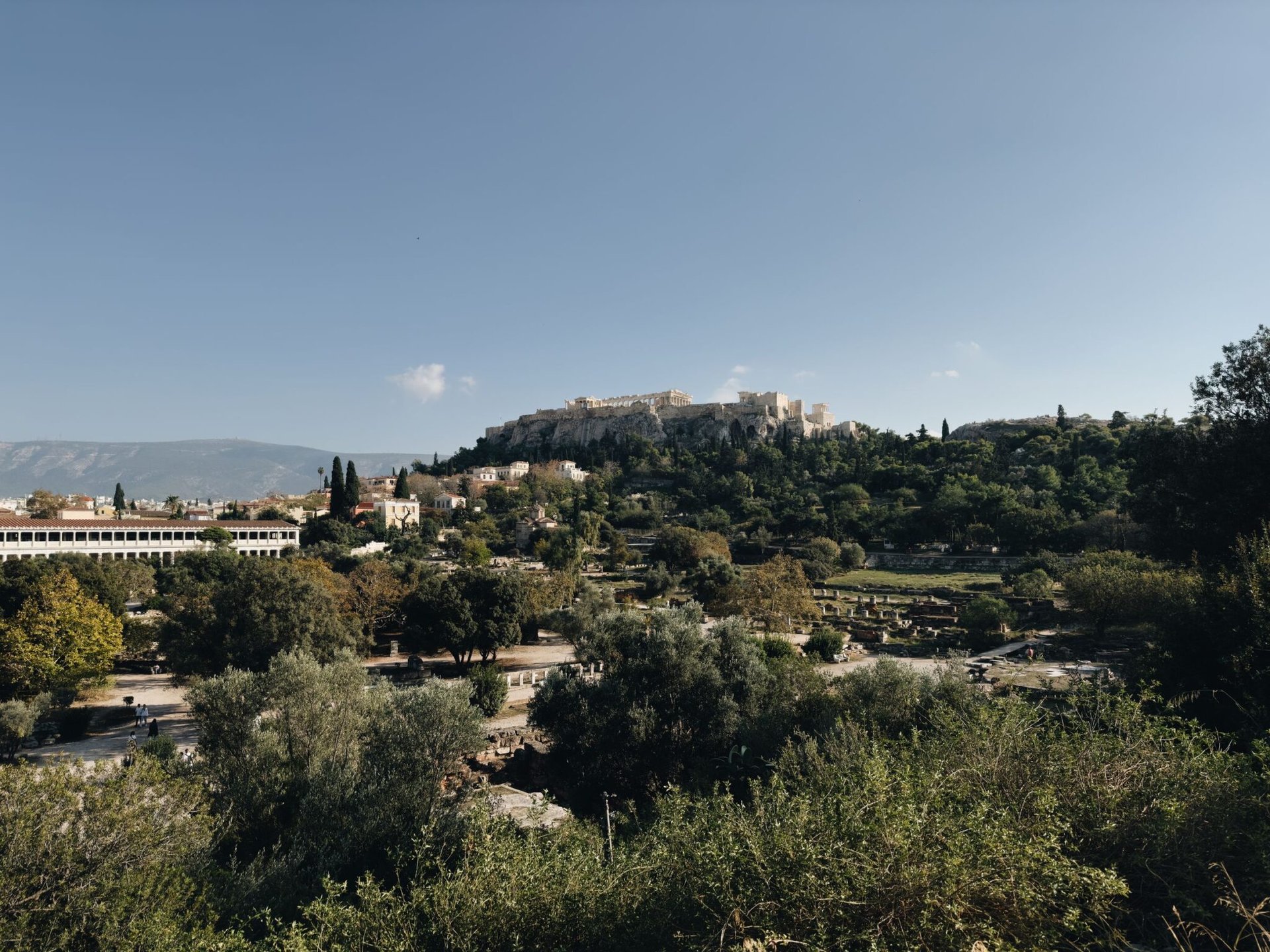 Picturesque view of Athens Acropolis overlooking the cityscape on a clear day.