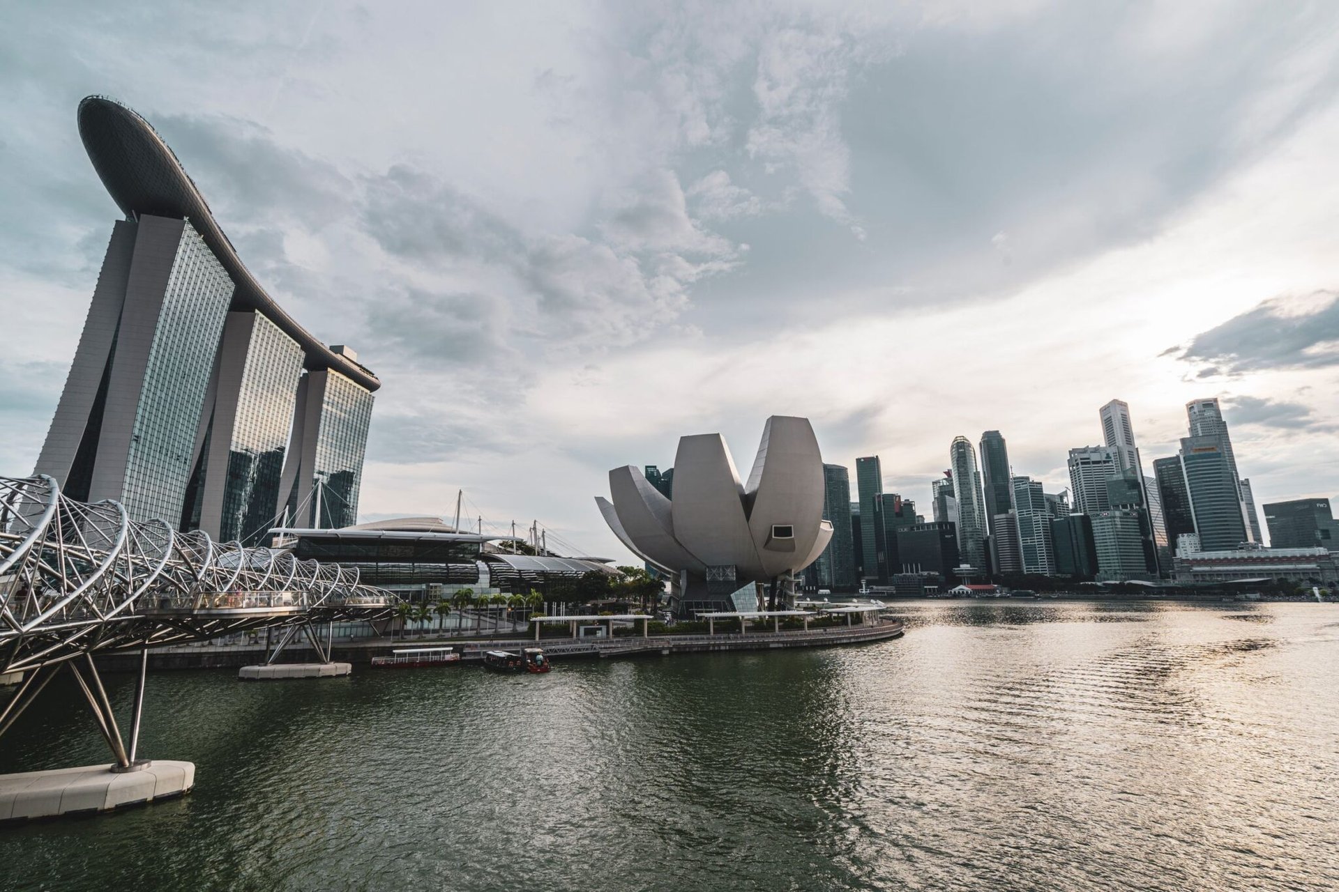 Breathtaking view of Singapore Marina Bay with iconic architecture and skyline during dusk.