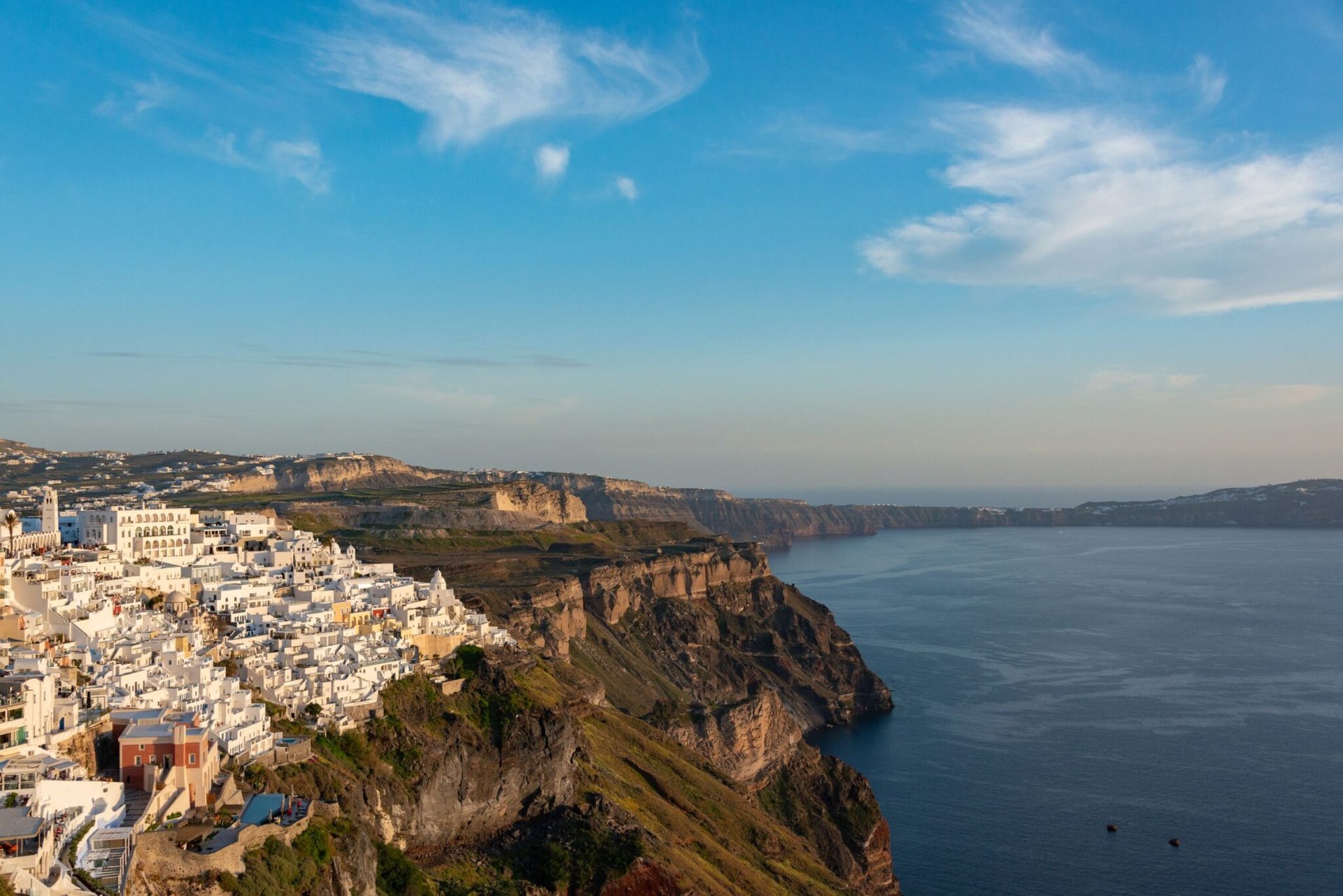 Breathtaking view of whitewashed buildings overlooking the Aegean Sea in Santorini, Greece.