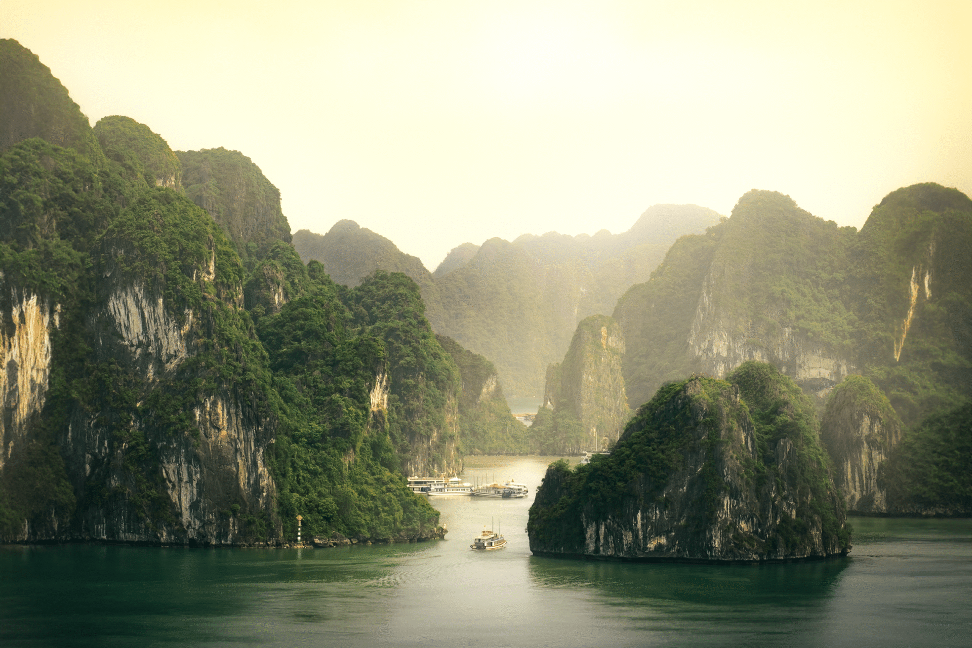 Explore the tranquil beauty of Ha Long Bay's limestone formations in Vietnam.