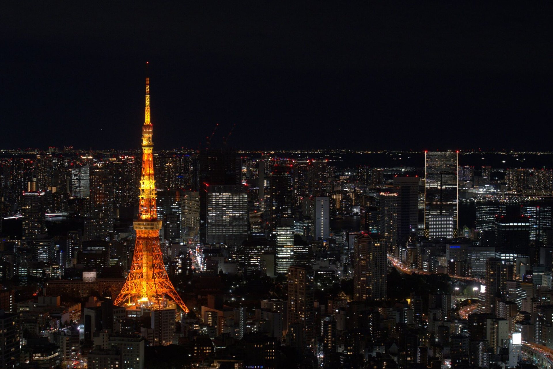 A stunning view of Tokyo Tower and city lights at night, Tokyo, Japan.