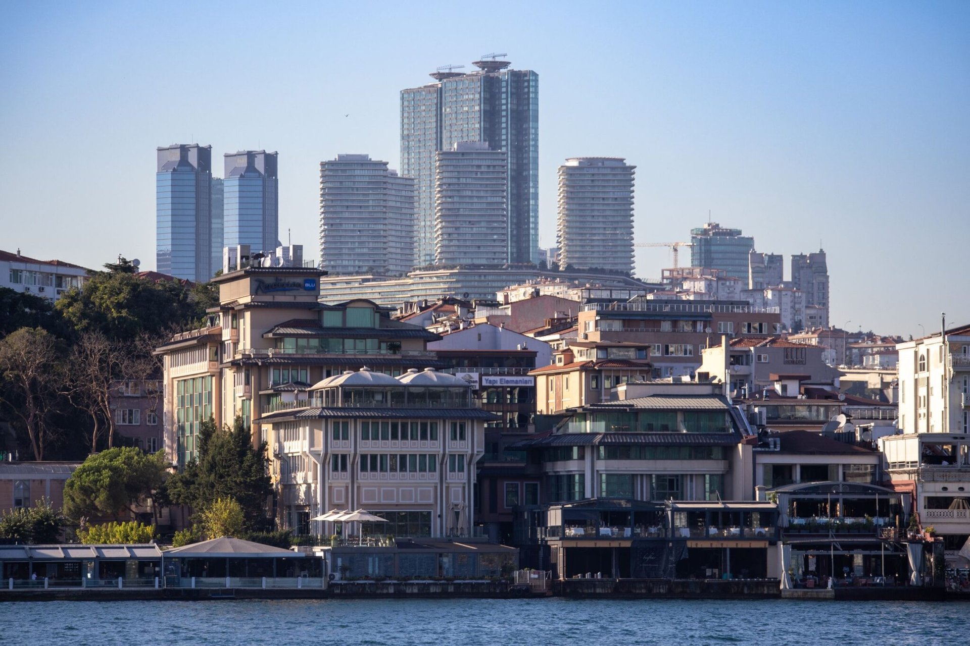 Istanbul skyline showcasing a blend of modern skyscrapers and historic architecture along the Bosphorus.